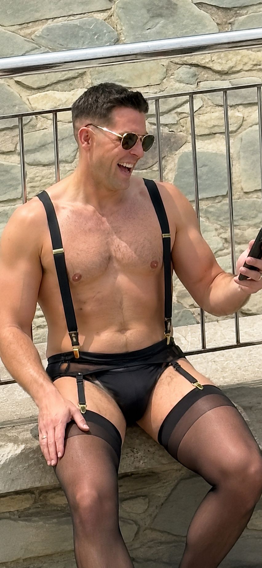 Harry Jackson, Head of Travel Disasters, posing confidently in lycra and stockings